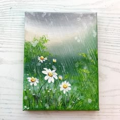 an acrylic painting of daisies in the rain on a white wooden background