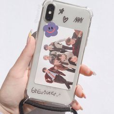 a person holding up a cell phone case with an image of the same character on it