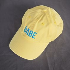 Babe Wine Branded Yellow Retro Looking Ball Cap Hat. These Are So Cute On, I Have Yet To See Someone Who Doesn't Look Good In One Of These Babies :) 1990s Style Yellow Dad Hat For Summer, Yellow Dad Hat Baseball Cap For Summer, 90s Style Adjustable Hats For Summer, 90s Style Adjustable Summer Hats, 90s Summer Cap, 90s Style Summer Cap, Retro Summer Dad Hat, Cute Summer Dad Hat, Vintage Spring Dad Hat With Letter Print