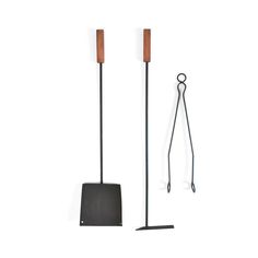 two shovels and a pair of tongs on a white background