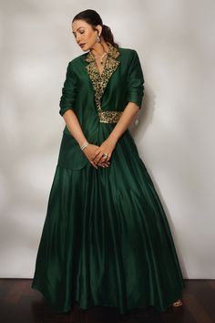 Emerald green blazer with floral hand embroidered collar in sequin and cutdana embellishments. Comes with box pleated lehenga.
Component: 2
Pattern: Hand Embroidered 
Type Of Work: Cutdana,Sequin,Floral
Neckline: Collar Neck
Sleeve Type: Full Sleeves
Fabric: Silk Chanderi
Color: Green
Other Details: 
Cutdana and sequin embellished collar
Front slit blazer
Note: Choker worn by the model is not for sale
Occasion: Sangeet - Aza Fashions Green Indian Outfit, Mehandi Dress, Pleated Lehenga, Embroidered Blazer, Anamika Khanna, Gaun Fashion, Embellished Collar, Sequin Blazer, Indian Gowns