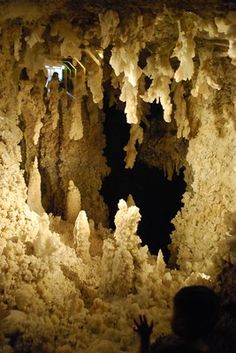 people are standing in the middle of a cave