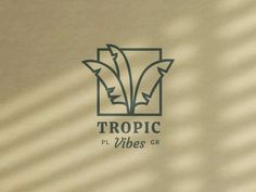 the logo for tropic vibes is shown on a beige background with shadows