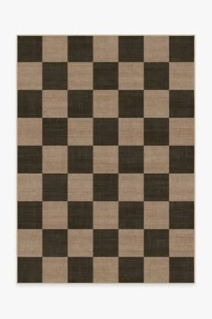 a brown and black checkered rug on top of a white wall