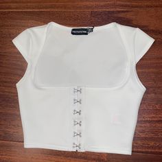 White Nwt Plt Crop Top. Very Low Scoop/Square Neck, With Hooks In The Front. Summer Square Neck Corset For Night Out, Summer Night Out Square Neck Corset, White Square Neck Top For Party, White Square Neck Corset For Spring, Fitted Square Neck Crop Top For Night Out, Trendy Fitted Square Neck Crop Top, Trendy White Square Neck Crop Top, White Square Neck Crop Top, Black Going Out Tops