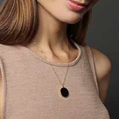 "Black onyx drop necklace on 14k dainty gold filled chain - Jewelry gifts for Her - Black and gold jewelry - Minimalist necklaces - Black Stone: Genuine black onyx Stone: 20mm diameter Gold chain: 14k gold filled Chain length: 18 inches Clasp: spring ring Arrives in gift box Made in the USA About \"Gold Filled Jewelry\": Also called rolled-gold. These jewelry items are not actually filled with gold. They are made of a base metal covered by sheets of gold in a mechanical bonding process. Effectiv Minimalist Circle Jewelry In 14k Gold Filled, Minimalist Circle Cable Chain Jewelry, Everyday Gold Plated Round Disc Necklace, Everyday Round Disc Gold Plated Necklace, Minimalist 14k Gold Filled Round Pendant Jewelry, Black Jewelry With Adjustable Round Chain, Black Round Jewelry With Adjustable Chain, Black Gold Plated Charm Necklace With Adjustable Chain, Minimalist 14k Gold Filled Round Disc Necklaces