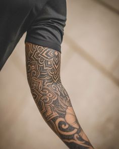 a man with a tattoo on his arm