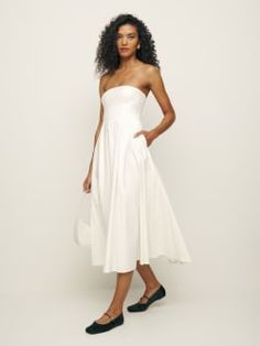 Big easy.  The Astoria is a strapless midi length dress with pockets. Elegant Strapless Midi Daywear Dress, Chic Strapless Midi Dress For Daywear, Reformation Strapless Dress, Reformation Alden Dress, Linen Casual Dress Reformation, Balia Linen Dress Reformation, Reformation White Linen Dress, Big Easy, Midi Length Dress