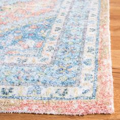 an area rug is shown on the floor with wood floors and hardwooding in the background