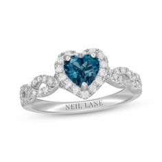 a heart shaped blue and white diamond ring with the name neil lane written on it