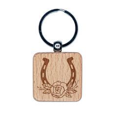 a wooden keychain with an image of a bull's head on it