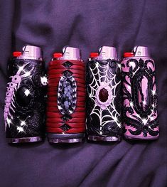 four different types of lighters are lined up in a row on a purple background