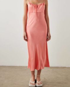 Just add slides or mules and you are good to go. The Laramie Dress is a sensual, party-ready silhouette designed with delicate, spaghetti straps and an adjustable drawcord at the neckline. Taking an elegant, minimalist approach, the coral color makes a subtle statement. Best of all, its done in a smooth, satin back crepe that looks as luxe as it feels. 55% Rayon 45% Viscose. A must-have! Round out your vacation and weekend wardrobe with this plus size dress Rails Laramie Dress in Coral | Coral | Dresses | Materials & Care Instructions: ['55% Rayon, 45% Viscose', 'Imported'] Coral Cocktail Dress, Dresses Materials, Coral Maxi Dresses, The Coral, Ruched Midi Dress, Coral Dress, Weekend Wardrobe, Satin Midi Dress, Coral Color