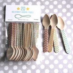 wooden spoons are lined up on a polka dot tablecloth with the number 20 printed on them