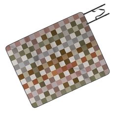 a brown and white checkerboard pattern on a mouse pad with black wire attached to it