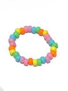 Beaded pastel rainbow bracelet (kandi) made with clear stretchy string. Rainbow Bracelet, Rainbow Beads, Bracelet Ideas, Pastel Rainbow, Transparent Png, Beaded Bracelet, Beauty Book, Jewelry Bracelets, Beaded Bracelets