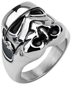 a silver ring with black stones in the shape of an elephant's head on it