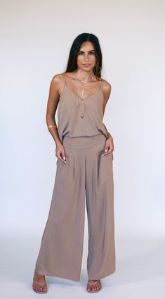 Bring a touch of boho flair in a pair that's truly a sight to behold. Reach for the Johanna Pants for days that lets you lounge indoors or head out for errands without having to think twice. Keep it low-key with a basic tank or take it up a notch with a silk top to make this versatile piece work its magic. With a wide-leg and flat-front silhouette, it's sure to be your new easy favorite. *Wide Leg Bottom *Flat-front Style *Side Pockets *100% Rayon *Hand wash cold *Made in Bali Bohemian Relaxed Fit Wide Leg Pants For Loungewear, Beige Bohemian Pants For Day Out, Bohemian Beige Pants For Day Out, Chic Wide Leg Lounging Pants, Chic Beige Pants For Lounging, Loosely Fitted Wide Leg Pants For Summer Lounging, Chic Summer Loungewear Harem Pants, Summer Lounging Ankle-length Pants, Chic Summer Harem Pants For Loungewear