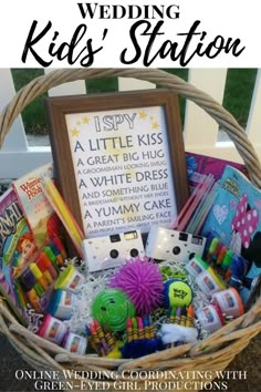 a basket filled with lots of kids's stuff and the words i spy wedding station