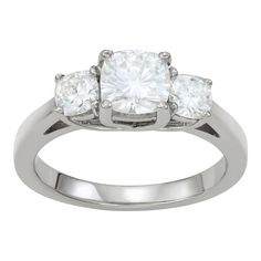 A trio of cushion-cut, lab-created moissanite gemstones give this Charles & Colvard three-stone ring a dazzlingly stylish look you'll love. A trio of cushion-cut, lab-created moissanite gemstones give this Charles & Colvard three-stone ring a dazzlingly stylish look you'll love. Width: 6.3 mm Metal: 14k white gold Plating: rhodium Finish: polished Packaging: boxedSTONE DETAILS Stone type: lab-created moissanite Total weight: 1 3/4 ct. Center stone weight: 1 1/10 ct. Center stone size: 6 3 Stone Rings, Three Stone Ring, Three Stone Rings, Three Stone, Cushion Cut, Stone Ring, Womens Jewelry Rings, Gold Plating, Stone Rings