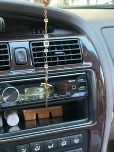 a car dashboard with an air vent hanging from it's dash board and radio