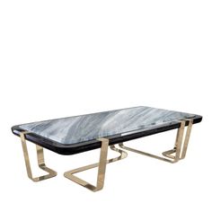 a black and white marble coffee table with brass legs on an isolated white background for display