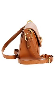 A supersoft leather handbag refined with satin-finished gleaming hardware and a crossbody strap for versatile carrying options. 8 1/2"W x 5"H x 4"D Magnetic flap Adjustable crossbody strap Lined Leather Imported Fall Crossbody Shoulder Bag With Gold-tone Hardware, Cognac Crossbody Bag With Leather Trim, Everyday Crossbody Box Bag With Gold-tone Hardware, Leather Crossbody Shoulder Bag With Gold-tone Hardware, Tan Crossbody Shoulder Bag With Gold-tone Hardware, Nordstrom Store, Leather Handbag, Crossbody Strap, Vince Camuto