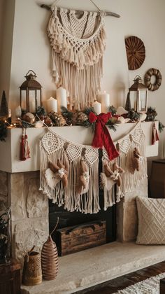 a fireplace decorated for christmas with stockings and candles