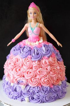 Barbie cake on a white cake pedestal. Doll Princess Cake, Princess Dress Cake Birthday, Barbie Doll Cake Design Simple, Easy Barbie Birthday Cake, Barbie Party Cake Ideas, Barbie Cake With Bundt Pan, Barbie Birthday Cake With Doll