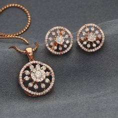 18k Rose Gold IGI Certified Natural Diamond Round Pendnt Earring Set Pendant Details: Material: 18K Rose Gold Detail of Pendant Total Weight : 1.72 Gram Pendant  chain : pendant and earring (without chain) NO. OF Diamond : 01 Diamonds         50 Diamonds Diamond Weight:   0.11 carats               0.43 carats Color Grade: E - F Clarity Grade: VVS Detail of Earring Total Weight : 4.01 Gram Earring chain : pendant and earring (without chain) Diamond Weight: 0.47 carats NO. OF Diamond : 92 Diamonds Luxury American Diamond Round Jewelry Sets, Dazzling Round Diamond Earrings With Elegant Design, Rose Gold Round Diamond Earrings With Halo Design, Dazzling Rose Gold Diamond Jewelry Sets, Rose Gold Round Halo Diamond Earrings, Exquisite Jewelry Sets With Brilliant Cut, Fine Jewelry Sets With Elegant Design, Single Cut Diamond Jewelry Sets, Dazzling Rose Gold Round Diamond Earrings