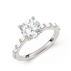 a white gold engagement ring with an oval cut diamond and baguetts on the side