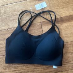 Nwt Arie Black Sports Bra Size Xs Black Stretch Bra With Built-in Padding, Black Strappy Back Sports Bra, Black Seamless Bra With Strappy Back, Black Athleisure Bra With Medium Support, Black Seamless Sports Bra For Loungewear, Black Yoga Bra With Medium Bust Support, Black Strappy Back Bra, Casual Black Bra With Built-in Cups, Black Activewear With Strappy Back