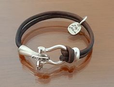 western jewelry Equestrian bracelet leather and pewter unique style horse gift for women looks great on small wrist or large wrist Classic Adjustable Jewelry With Silver Buckle, Adjustable Silver Jewelry For Shows, Adjustable Horse Design Bracelet, Silver Leather Bracelet With Lobster Clasp For Everyday, Everyday Silver Leather Bracelet With Lobster Clasp, Adjustable Silver Leather Bracelet With Lobster Clasp, Equestrian Bracelet, Women Looks, Horse Gifts