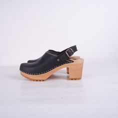 MADE FROM BEST QUALITY NUBUCK LEATHER AND ALDER WOOD Clogs for Women Lotta High heals ergonomic wooden sole and soft leather. Adjustable buckle clasp on the ankle. Stable heel. The sole is made of rubber. made to order. Available in sizes 36-41. For other sizes please contact me EUR 35 l UK 2.5 l AUS 4.5 l USA 5 l up to 22.3cm l 8.78 inches EUR 36 l UK 3.5 l AUS 5.5 l USA 6 l up to 23cm l 9.02 inches EUR 37 l UK 4 l AUS 6 l USA 6.5 l up to 23.7cm l 9.33 inches EUR 38 l UK 5 l AUS 7 l USA 7.5 l u Casual Clogs With Heel Loop And High Heel, Casual High Heel Clogs With Heel Loop, Black Clogs With Reinforced Heel For Summer, Casual Slingback Clogs With Wooden Heel, Black Summer Clogs With Reinforced Heel, Black Clogs With Rubber Sole And Block Heel, Black Clogs With Heel Strap And Block Heel, Casual Slingback Clogs With Stacked Heel, Casual High Heel Clogs With Buckle Closure