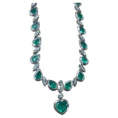 This remarkable necklace showcases an impressive 18-carat green emerald, beautifully complemented by 15 carats of additional natural green emeralds, all meticulously set in radiant 18K white gold. The centerpiece of this exquisite necklace is the breathtaking 18-carat emerald, which captivates with its rich, vibrant hue and exceptional clarity. Surrounding this magnificent gemstone, a series of expertly cut natural emeralds add to the necklace's allure, enhancing its overall brilliance and elega White Gold Necklace, White Gold Necklaces, Fine Jewels, Green Emerald, 3 Carat, Multi Strand Necklace, Gorgeous Jewelry, Natural Emerald, Emerald Diamond