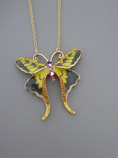 "Vintage Jewelry - Butterfly Necklace - Vintage Inspired Necklace - Crystal Necklace - Yellow Necklace - Gold Necklace - Handmade Jewelry This is such a gorgeous necklace! This large gold plated Butterfly is embellished with yellow and black enamel and sparkling topaz, red opal and yellow rhinestones The pendant hangs from a gold plated chain. Chloe says, Wear it and feel fabulous!\" The pendant is 2\" long and 2\" wide. You can choose the chain length you would like at checkout. Thanks for visi Yellow Metal Necklace With Adjustable Chain, Yellow Metal Necklace As Gift, Yellow Metal Necklace For Gift, Yellow Jewelry With Butterfly Charm For Gift, Yellow Butterfly Jewelry Gift, Butterfly Pendant Necklace As A Gift, Unique Butterfly Charm Pendant Necklace, Butterfly Pendant Necklace For Gift, Butterfly Pendant Necklace For Gifts