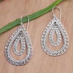 The mesmerizing designs on Made Suyana's dangle earrings will leave you giddy with excitement. The Balinese artisan uses sterling silver to create the earrings, hand crafting intricate, openwork designs that radiate around concentric teardrops. Bohemian Pierced Teardrop Earrings In Sterling Silver, Ornate Sterling Silver Teardrop Earrings For Gift, Ornate Sterling Silver Teardrop Earrings As Gift, Artisan Sterling Silver Nickel-free Teardrop Earrings, Artisan Sterling Silver Teardrop Dangle Earrings, Sterling Silver Intricate Teardrop Earrings, Sterling Silver Teardrop Earrings With Intricate Design, Sterling Silver Chandelier Earrings With Intricate Design, Sterling Silver Chandelier Earrings With Intricate Design For Gift