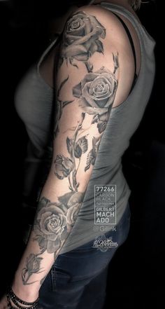 a woman's arm with roses on it