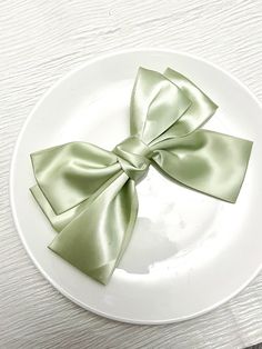 a white plate with a green bow on it