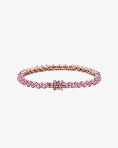 Introducing our Princess Mini Stack Tennis Bracelet, a fusion of elegance and everyday versatility. This bracelet, set with 4.80 carats of 2x2mm princess-cut pink sapphires and 0.95 carats of baguette white diamonds, is a statement of style. Details 18k rose gold 4.80 carats of 2x2mm princess-cut pink sapphires 0.95 carats of white diamond baguettes Bracelet measures 7" inches in length Box clasp with safety lock fastening 4.5mm width Ref: AKB430 Classic Pink Tennis Bracelet With Jubilee Design, Classic Pink Tennis Bracelet With Jubilee Style, Pink Jubilee Tennis Bracelet In Classic Style, Classic Pink Tennis Bracelet, Luxury Pink Sapphire Bracelets, Luxury Pink Sapphire Round Jewelry, Luxury Rose Gold Pink Sapphire Jewelry, Luxury Pink Jewelry With Prong Setting, Luxury Rose Gold Jewelry With Sparkling Stones