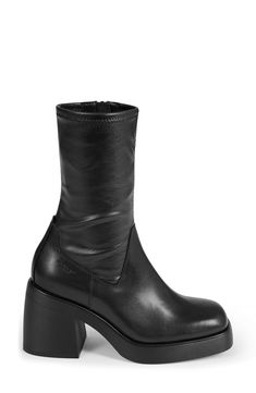 Enhance your ensemble with a bit of drama in this stretchy, contour-hugging boot set on a square-toe platform and conspicuously chunky block heel. 3 1/4" heel 9 1/4" shaft Side zip closure Synthetic upper/leather lining/synthetic sole Imported Edgy Square Toe Platform Boots For Fall, Chunky Platform Heeled Boots With Square Toe, Fitted Heeled Boots With Chunky Platform And Square Toe, Black Platform Boots With High Shaft, Fitted Chunky Platform Heeled Boots With Block Heel, Edgy Fitted Platform Boots With Block Heel, Edgy Chunky Platform Boots With Square Toe, Black Square Toe Platform Boots, Sleek Black Platform Heeled Boots