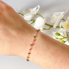 This beautifully simple rosary bracelet is lovingly handmade with multi-coloured Tourmaline gemstones. M A T E R I A L S: * Tourmaline * Sterling Silver S I Z E: * Gemstones - Approximately 2-4mm * Length - Various All of our jewellery is carefully handmade using good quality materials and handpicked gemstones, with the aim to produce quality pieces that you can love & wear for years to come. T O U R M A L I N E: * October Birthstone * Talisman for Capricorn, Aries, Virgo & Libra * Heart Chakra Tourmaline aids in understanding oneself and others. It promotes self-confidence and diminishes fear. Tourmaline attracts inspiration, compassion, tolerance and prosperity. Your bracelet will arrive in a white jewellery box ready for gifting or for storage. Gift wrapping is also available at checkou Capricorn Aries, Aries Virgo, White Jewelry Box, Tourmaline Bracelet, Rosary Bracelet, Wire Wrapped Bracelet, Moonstone Bracelet, Simple Bracelets, Birthstone Bracelets