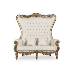 a white and gold couch with pillows on it's back end, sitting in front of a white background