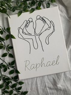 a drawing of two hands holding each other with the word raphael written on it in cursive writing