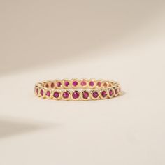 Ruby is a stone of royalty, highly coveted for its rich red hue. This can be your vibrant and unique wedding band, yet also the perfect dainty ring to add a pop of color to your solid gold ring stack. This is a full eternity band surrounding the entire finger.  Choose your metal and size, and we will make it custom for you. July's birthstone, this is a stunning ring to stack with your wife's wedding ring! - Handmade - Solid Gold - Natural Ruby - Total Ruby Carat Weight: 1 ctw for size 6.5 - Width of the Band: 2.5 mm - Height of the Band: 1.7 mm 🛠 Your Sarah Elise piece is handcrafted with care! Ready-to-ship items go out within 3 business days. Made-to-order pieces typically take 7-10 business days to create. If you need something sooner, please contact us - we'll see if we can make it ha Bezel Eternity Band, Birthstone Wedding Ring, Ruby Eternity Ring, Ruby Eternity Band, Bezel Band, Ruby Bands, Ring Ruby, Ruby Wedding, Handmade Fine Jewelry