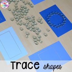 a table topped with lots of crafting supplies on top of a wooden floor covered in buttons