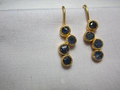 natural blue sapphire earrings  blue sapphire slice  sterling silver 925 gold micron pleating over sterling silver   matt finish polish  length 18 mm  drop length 28 mm approximately  width  5 mm  approximately  if you want any alteration and changes in earrings it can possible with different price and time as custom order. you can contact me by etsy conversation  thank you. feel  free to ask question Elegant Blue Hammered Earrings, Blue Hammered Drop Earrings, Elegant Hand Forged Blue Earrings, Hand Forged Blue Round Earrings, New Design Earrings, Sapphire Earring, Yellow Sapphire Rings, Tourmaline Earrings, Design Earrings