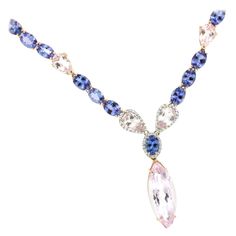 Amazing neckalce by Stanoppi Jewellery . The unique and bright colors of the Tanzanite and Kunzite natural stones make this set a unique and unrepeatable piece. This necklace has an straordinary elegance and unique design . Handmade in Italy by Stanoppi Jewellery since 1948. Modern necklace made in 18 karat rose and white gold, with Tanzanite in oval cut Karat 54,00 (size: 5x7 mm), Kunzite in marquise cut (size: 10x24 mm) and White diamond ct 0.65 VS colour G/H. All Stanoppi Jewelry is new and h Diamond Necklace And Earrings, Kunzite Jewelry, Elegant Pouch, White Diamond Necklace, Modern Necklace, Modern Necklaces, Jewel Box, Necklace And Earrings, Drop Necklace