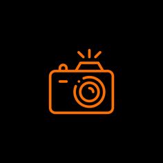 an orange camera on a black background