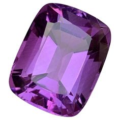 GEMSTONE TYPE: Natural Amethyst PIECE(S): 1 WEIGHT: 15.55 Carats SHAPE & Cut: Cushion Cut SIZE (MM): 17.37 x 13.54 x 10.38 COLOR: Purple CLARITY: Eye Clean TREATMENT: None ORIGIN: Brazil CERTIFICATE: On demand (if you require a certificate, kindly request it before proceeding with the payment) Presenting a stunning 15.55 Carats Natural Amethyst Gemstone, skillfully cut into a classic cushion shape, radiating with an enchanting deep purple hue. Sourced from the renowned gem mines of Brazil, this Classic Cushions, Gem Mining, Rich Purple, Purple Hues, Timeless Treasures, Amethyst Gemstone, Cushion Cut, Deep Purple, Rich Color